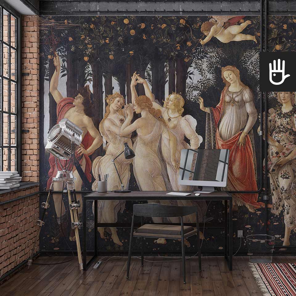 Industrialne wnętrze pracowni w stylu loftowym z przepiekną fototapetą Primavera przedstawiającą słynny renesansowy obraz autorstwa Sandro Botticelli.