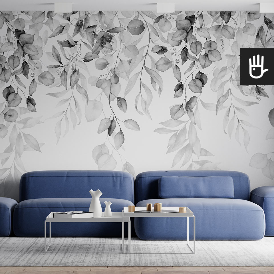 Fototapeta girlanda szarości w czarno-białym kolorze na białym tle na ścianie nowoczesnego salonu z granatową kanapą.