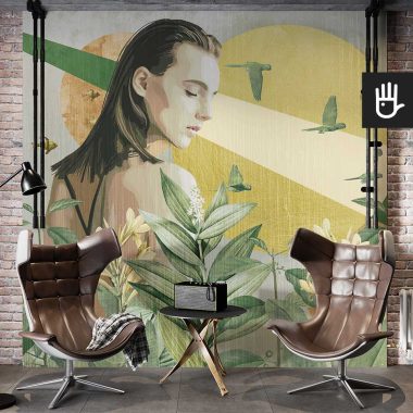 Loftowe studio ze skórzanymi fotelami z dekoracyjną ścianą ozdobioną fototapetą z kobietą i bujną roślinnością
